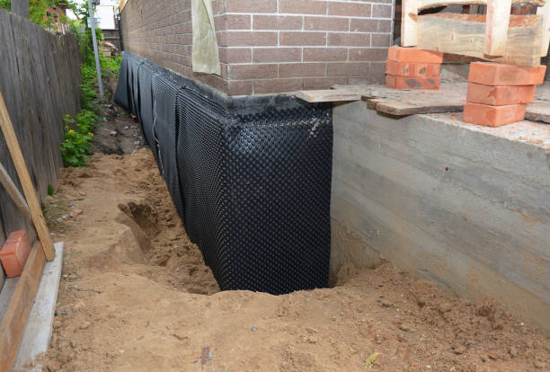 SJ Waterproofing Pros technician performing targeted Exterior Waterproofing assessment in Thorsby, AL
